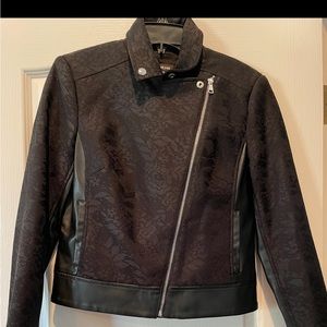 Black coat with unique design and cross body zipper